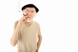 Senior man in beret with cigarette