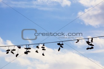sneakers hanging on a wire to mark drug sale area