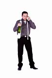 Businessman celebrating with a bottle of drink