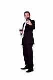 Businessman  with a glass of drink taking a picture