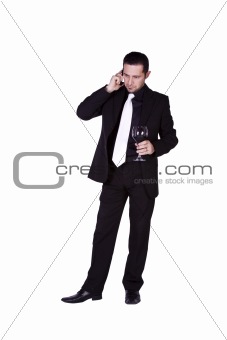 Businessman celebrating with a glass of drink
