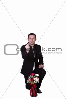 Businessman with Flowers and a Ring Proposing