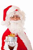 Old happy Santa Claus holding Christmas gift in hand