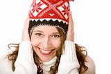 Young attractive smiling woman is freezing and wears  cap and sc