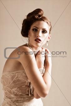 Attractive Young Woman Wearing Pearls and Nightwear