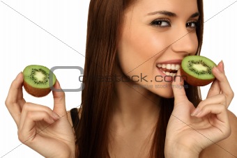 The girl eats a kiwi