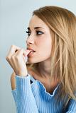worried woman biting her nails