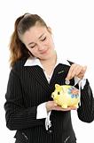  business woman looking at her savings in a piggy bank 