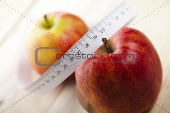 Tape measure and apple
