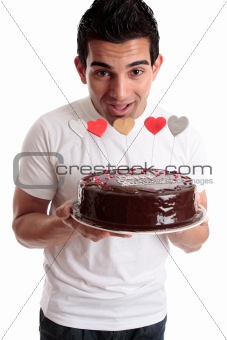 Cheeky man with a birthday cake