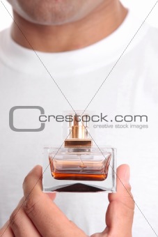 Man holding perfume aftershave