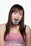 Teen Girl with a Blue Tongue. Isolated.