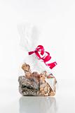 assortment of delicious chocolate truffles in bag with red ribbon