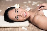  bautiful smiling woman lying down for spa treatment