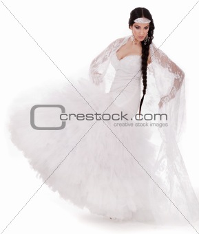 Young brunette dancing bride in white gown