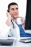 Portrait of young doctor talking over telephone and having coffee
