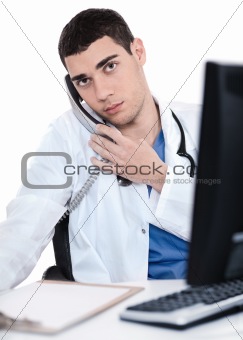 Male doctor speaking over telephone