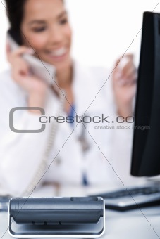 Telephone of focus, doctor talking with it