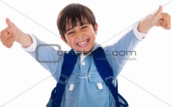 Cheerful school boy showing his thumbs up