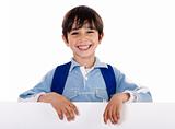 Smiling young boy behind the blank board