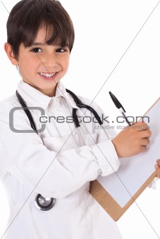 Little boy doctor writes on his clipboard for diagnosis