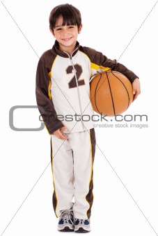 Adorable young kid in his sports dress with ball