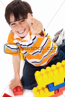 Boy shows ok sign when playing 