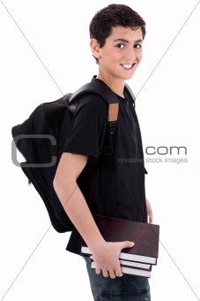 Side pose of handsome teenager boy student with books in hand
