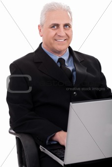 Mature business man working in notebook