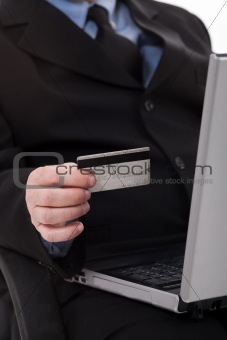 Business man with credit card focus on card