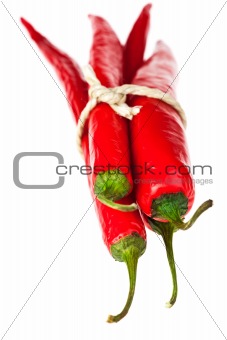bunch of red hot chili peppers on white background
