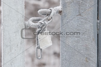 Locked padlock with snow
