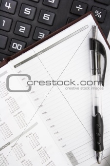 Calculator, Pen and Notebook