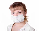 woman with brown hair and a medical mask 