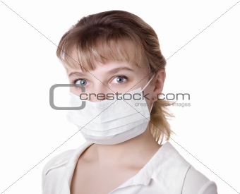 woman with brown hair and a medical mask 