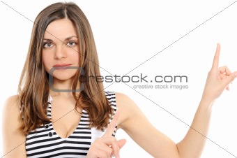 Happy young woman pointing at copy space