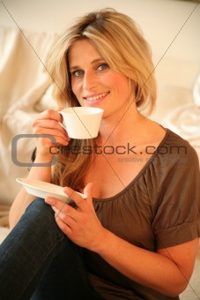Portrait of Young Woman Having a Cup of Coffee