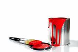 a red paint bucket and brush
