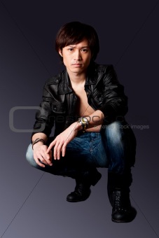 Handsome Asian man with leather jacket