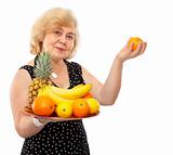 elderly happy woman treat fresh fruits