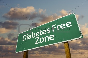 Diabetes Free Zone Green Road Sign In Front of Dramatic Clouds and Sky.