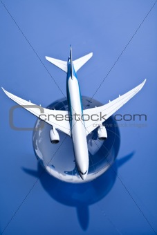 Airliner with earth in the blue background