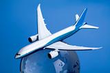 Airliner with earth in the blue background