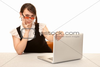 Pretty female office worker with laptop computer
