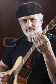 Middle-Aged Man With Acoustic Guitar