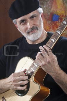 Middle-Aged Man With Acoustic Guitar