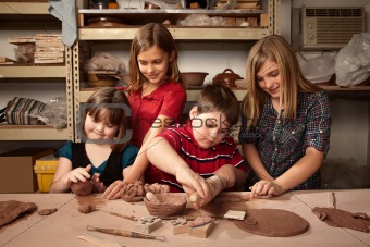 Children in a clay studio
