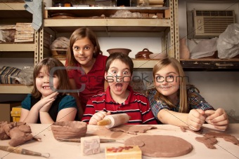 Children in a clay studio