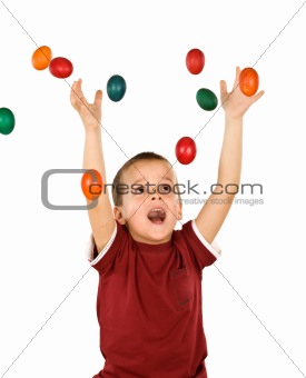 Little boy with falling easter eggs - isolated