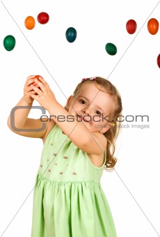 Little girl catching the easter eggs